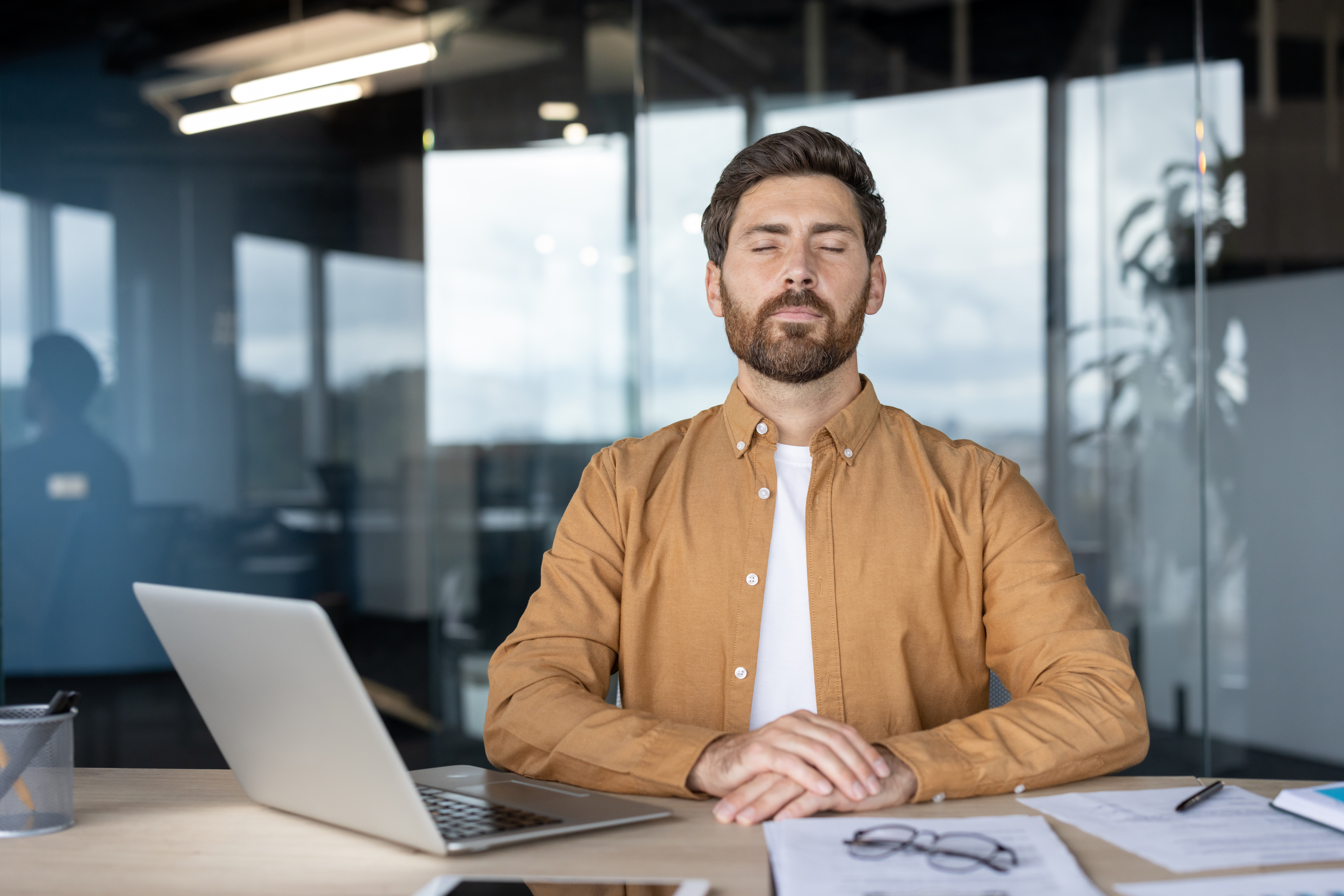 Working professional in a moment of considered thought